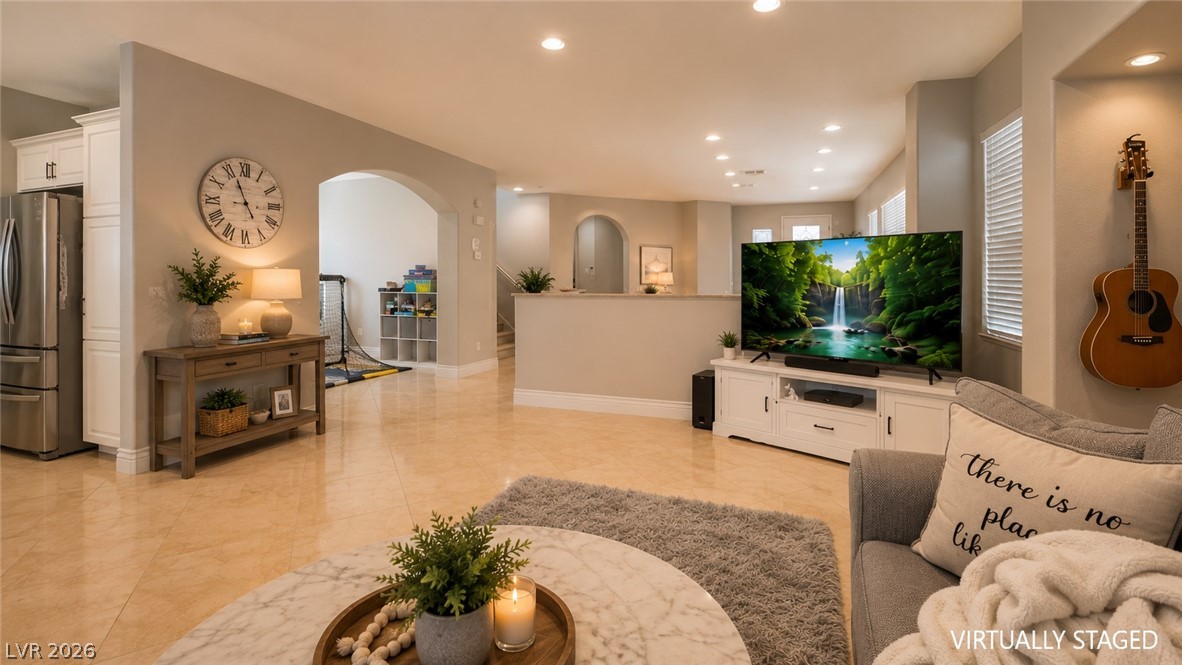 87 Tall Ruff Drive Las Vegas, NV 89148 - Photo 47 of 71 An inviting open-concept living space features warm tile flooring and recessed lighting throughout.