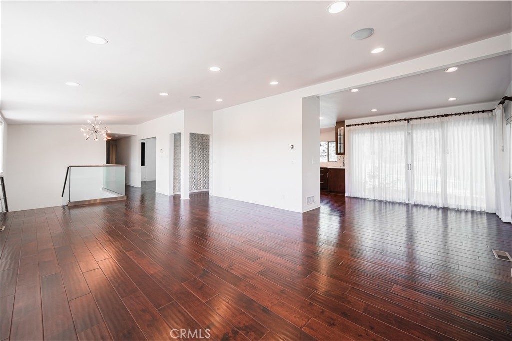 105 West Kenneth Road Glendale, CA 91202 - Photo 11 of 48 a view of an empty room with wooden floor and a large window