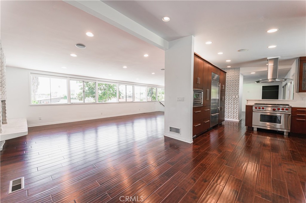 105 West Kenneth Road Glendale, CA 91202 - Photo 13 of 48 a view of a big room with wooden floor and windows