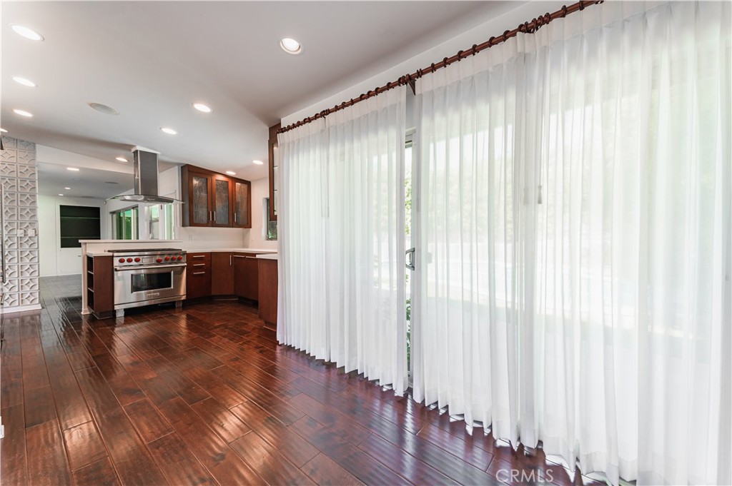 105 West Kenneth Road Glendale, CA 91202 - Photo 14 of 48 a living room with stainless steel appliances furniture and a wooden floor