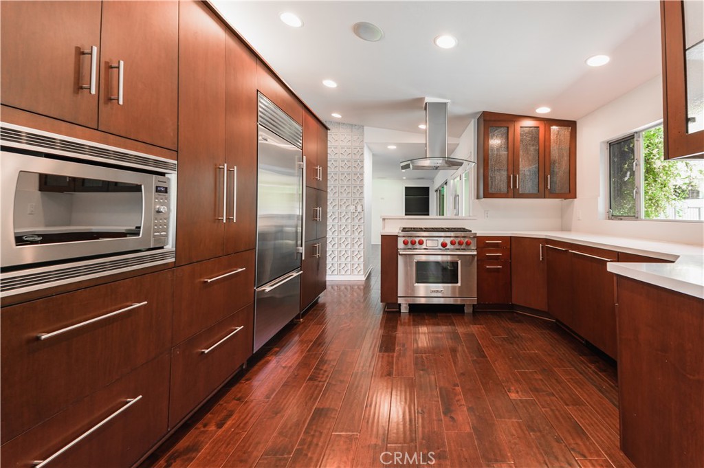 105 West Kenneth Road Glendale, CA 91202 - Photo 15 of 48 a kitchen with stainless steel appliances a stove a sink and a refrigerator