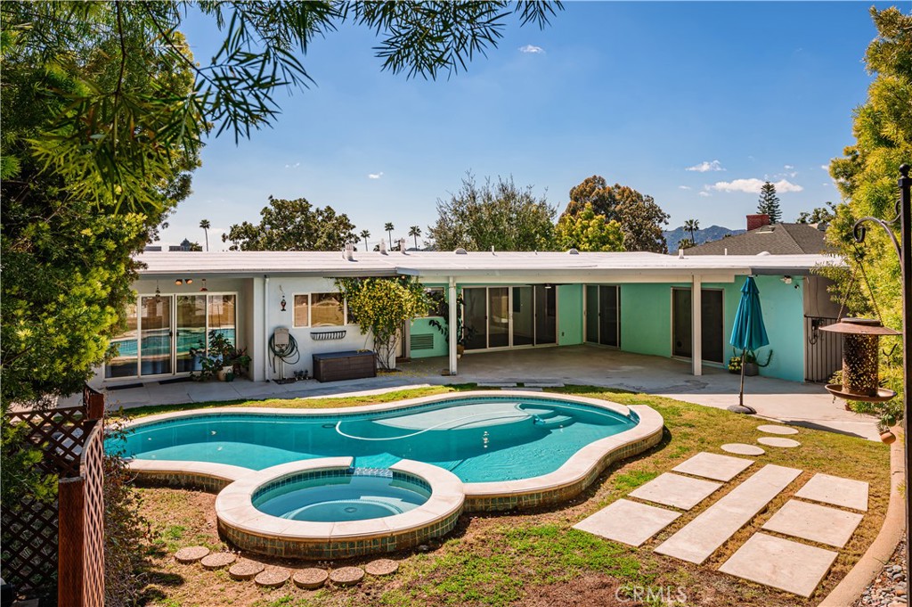 105 West Kenneth Road Glendale, CA 91202 - Photo 2 of 48 a view of a house with swimming pool and porch