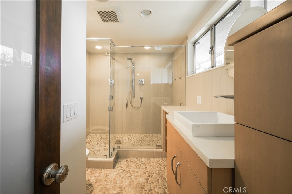 105 West Kenneth Road Glendale, CA 91202 - Photo 26 of 48 a bathroom with a sink a toilet and shower