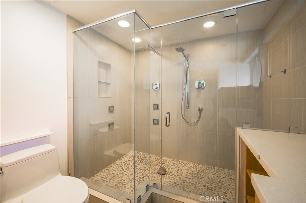 105 West Kenneth Road Glendale, CA 91202 - Photo 27 of 48 a bathroom with a shower and a toilet