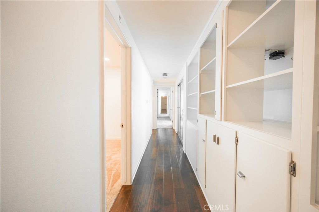 105 West Kenneth Road Glendale, CA 91202 - Photo 29 of 48 a view of a hallway with wooden floor and staircase