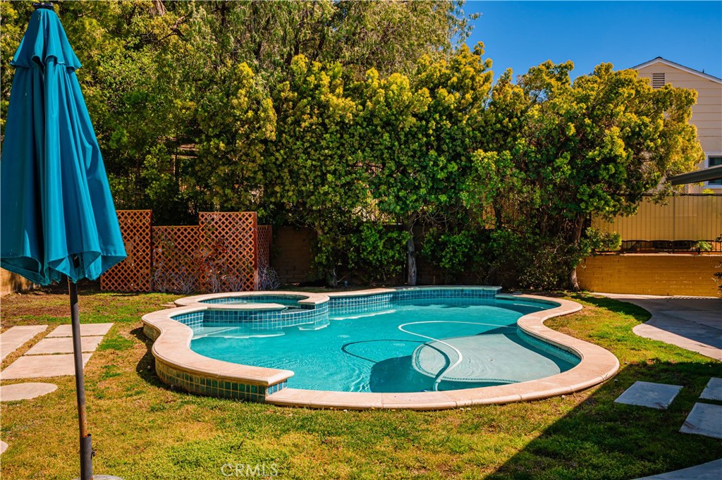 105 West Kenneth Road Glendale, CA 91202 - Photo 41 of 48 a view of a swimming pool with a yard