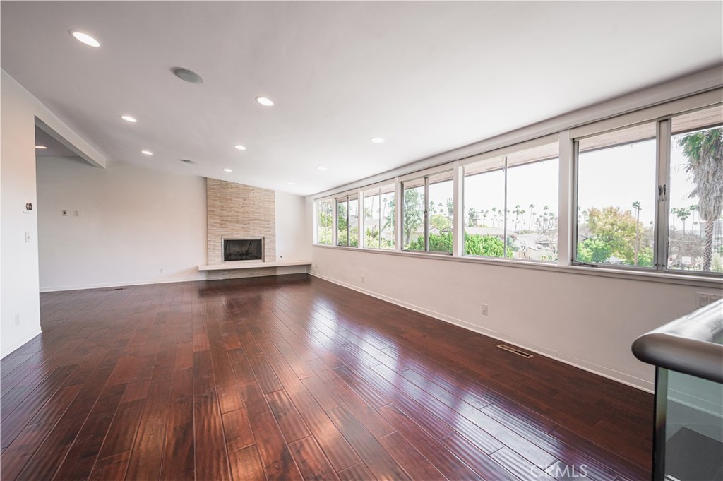105 West Kenneth Road Glendale, CA 91202 - Photo 10 of 48 a view of empty room with wooden floor and fan