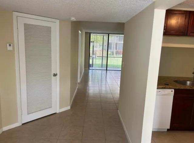 an entryway of a house and an entryway with wooden floor