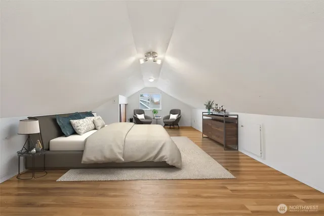 a bed room with a bed mirror and a night stand