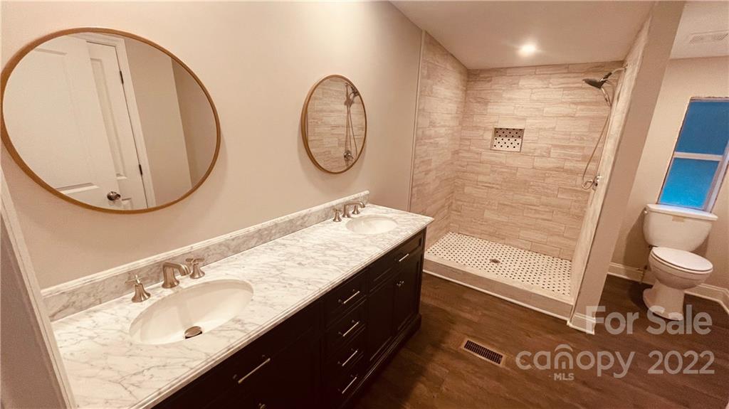 3246 Daystar Road Lancaster, SC 29720 - Photo 10 of 13 a bathroom with a sink and a mirror