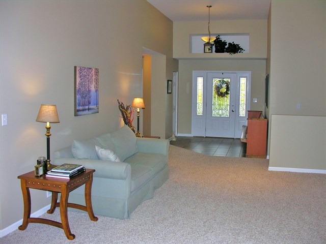 7209 Cornflower Way Spring Grove, IL 60081 - Photo 16 of 25 a living room with furniture and a window
