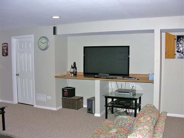 7209 Cornflower Way Spring Grove, IL 60081 - Photo 22 of 25 a living room with furniture and a flat screen tv