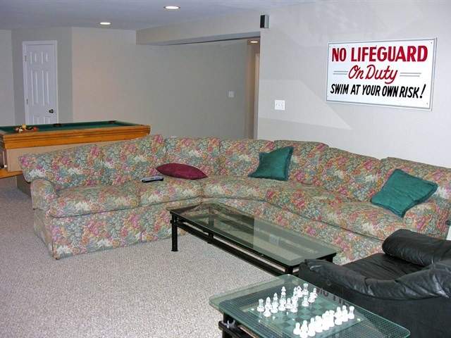 7209 Cornflower Way Spring Grove, IL 60081 - Photo 23 of 25 a living room with furniture and a chandelier