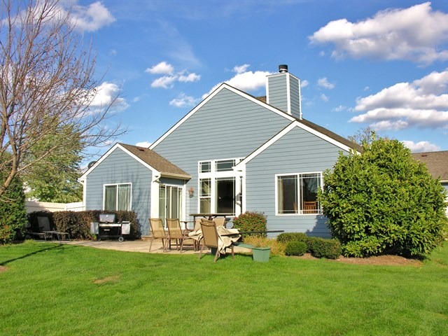 7209 Cornflower Way Spring Grove, IL 60081 - Photo 7 of 25 a front view of house with yard barbeque and outdoor seating
