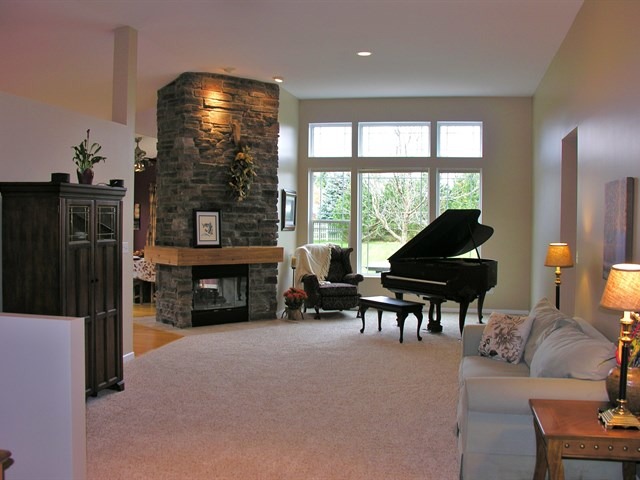 7209 Cornflower Way Spring Grove, IL 60081 - Photo 8 of 25 a living room with furniture and a floor to ceiling window