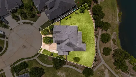 an aerial view of residential house with outdoor space