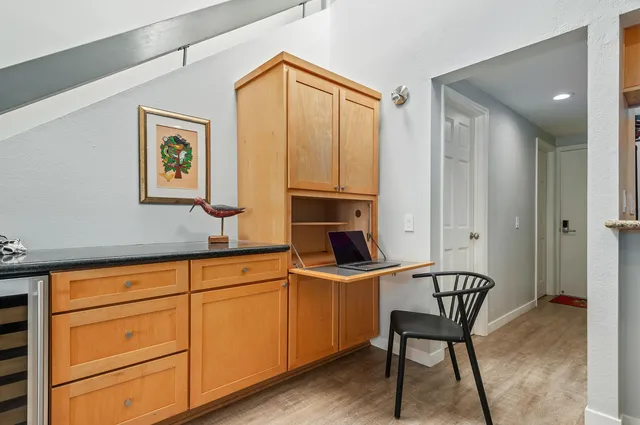 a room with furniture a rug and a window