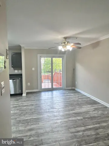 a view of a street with wooden fence