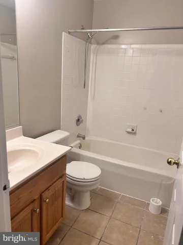 a bathroom with a sink a toilet and a bathtub