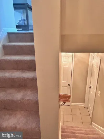 a view of an empty room with a fan