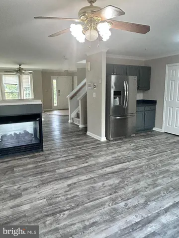 a kitchen with stainless steel appliances granite countertop a stove top oven a sink and dishwasher
