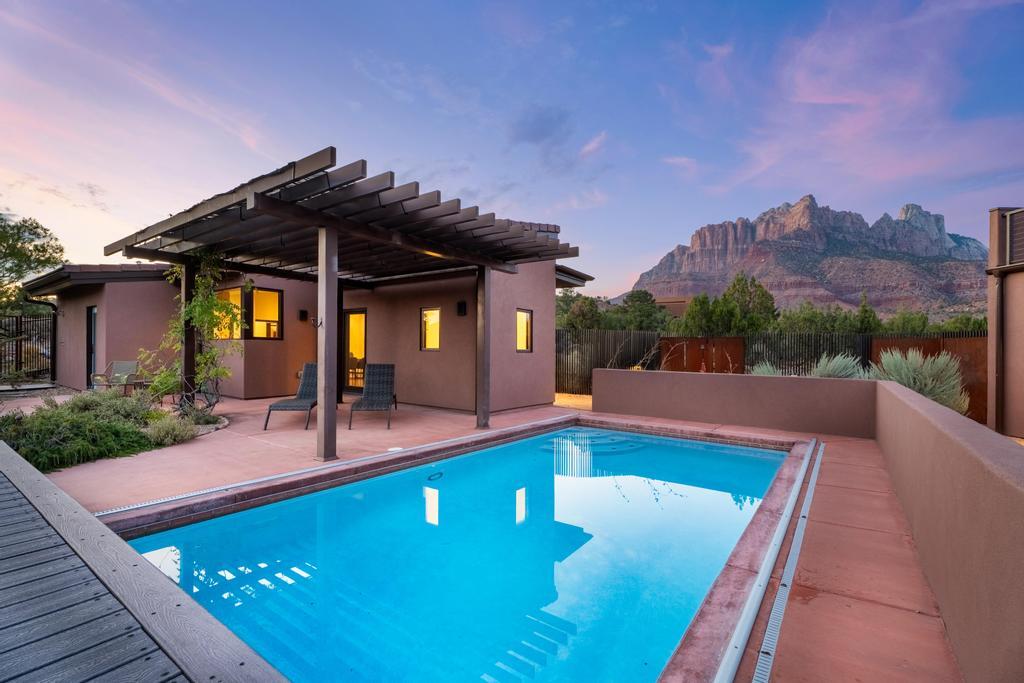 2548 Anasazi Way Springdale, UT 84767 - Photo 1 of 1 Step outside to your private swimming pool, where the stillness of the plateau meets the shimmer of water.