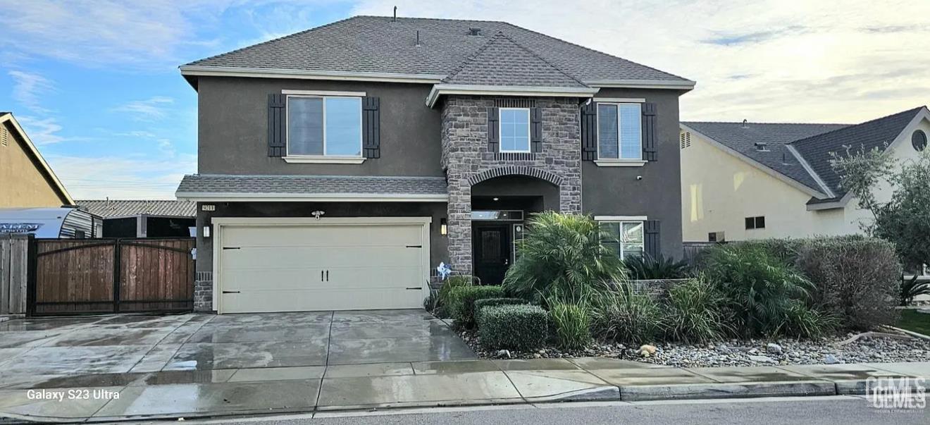 Undisclosed Address Shafter, CA 93263 - Photo 1 of 34 a front view of a house with a yard