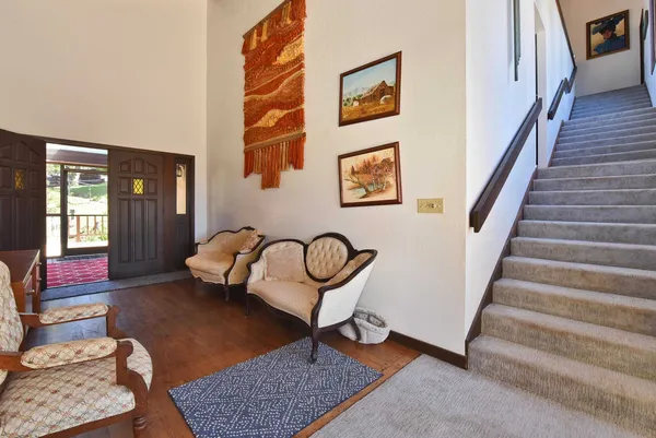 a living room with furniture and a rug