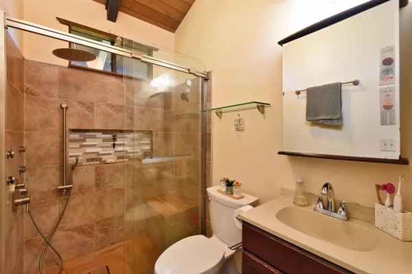 a bathroom with a sink toilet and shower