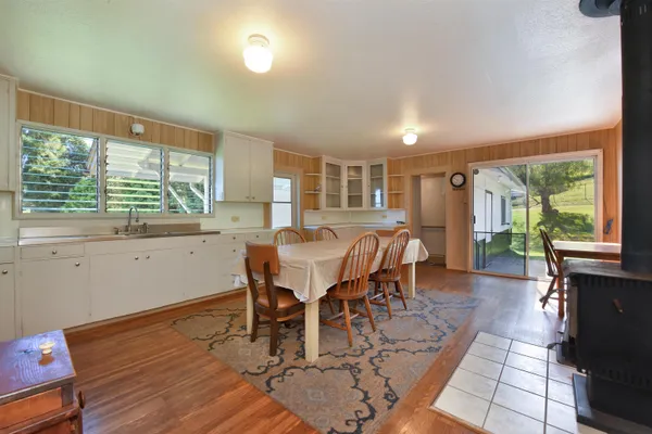 a view of a dining room with furniture window and outside view