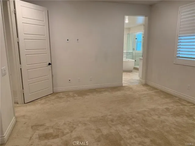 a white toilet sitting next to a shower