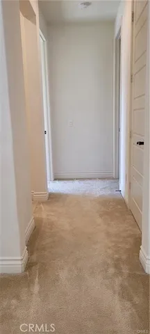 a front view of a house with swimming pool and a yard