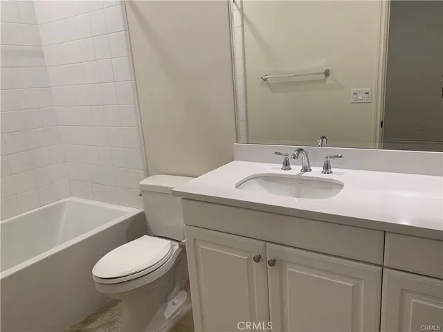 a view of a patio with a table and chairs