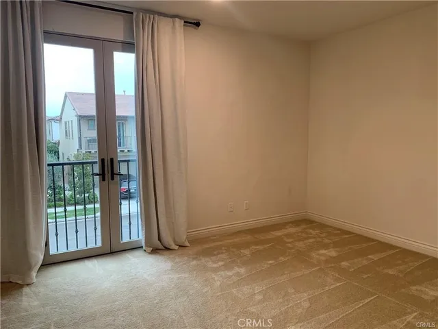a view of backyard with outdoor seating and green space