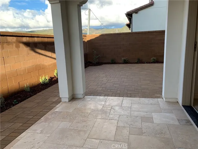a bathroom with a granite countertop sink a toilet and a mirror