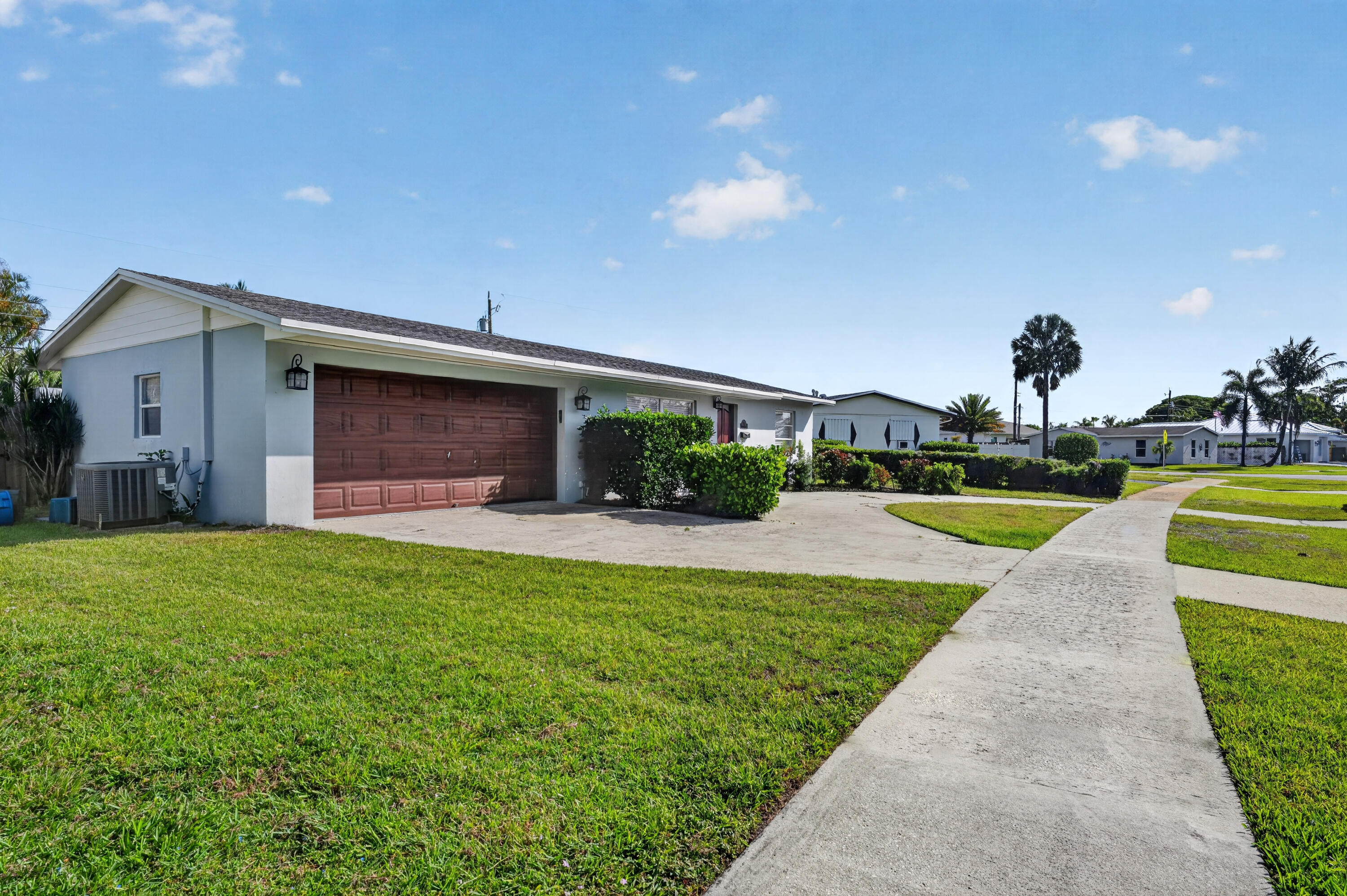 760 Cinnamon Road North Palm Beach, FL 33408 - Photo 3 of 19 Front of Home