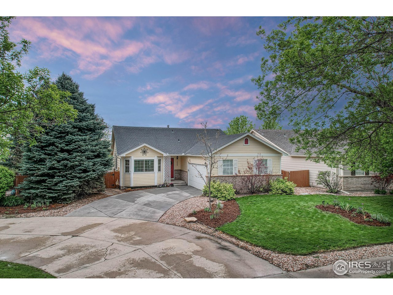 7032 Avondale Road Fort Collins, CO 80525 - Photo 2 of 40 Off street on eyebrow driveway. Mature landscaping meticulously maintained.