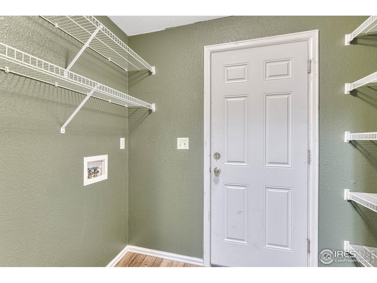 7032 Avondale Road Fort Collins, CO 80525 - Photo 20 of 40 Main floor laundry off the garage access door. Storage shelves included.