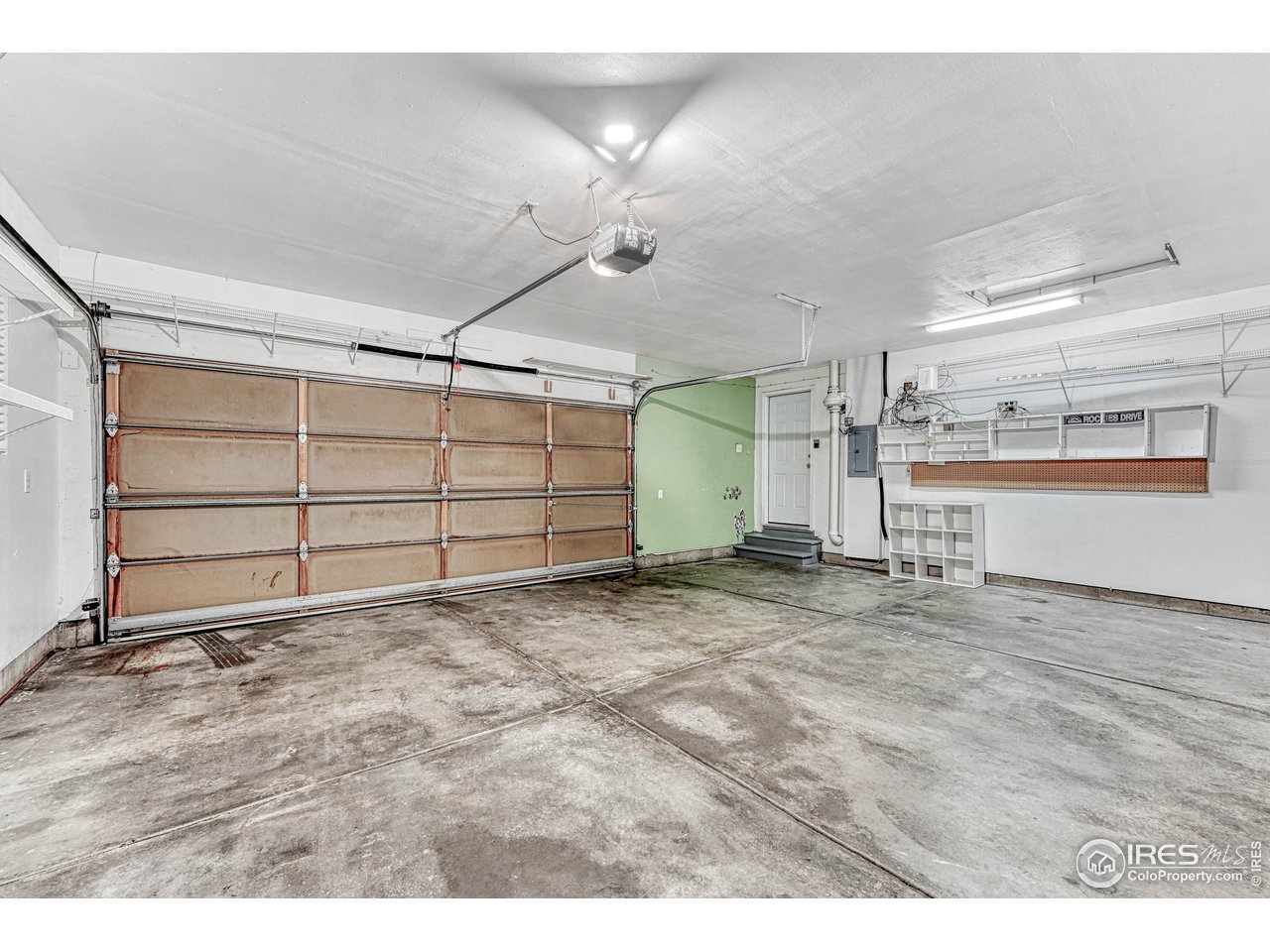 7032 Avondale Road Fort Collins, CO 80525 - Photo 21 of 40 Oversized 2 car garage, finished, painted and ready for your vehicles or toys.