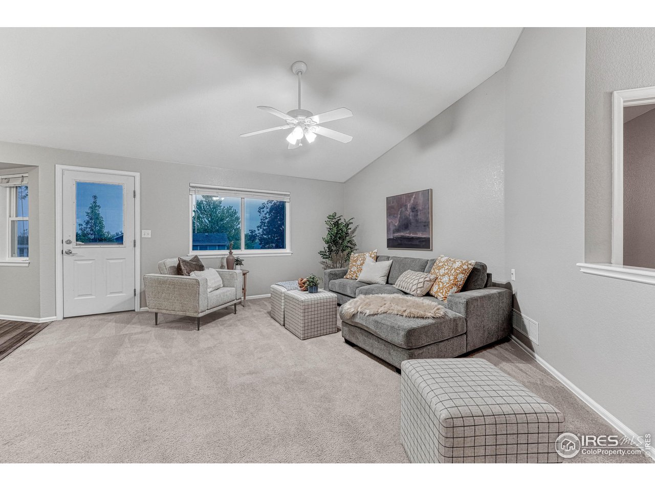 7032 Avondale Road Fort Collins, CO 80525 - Photo 40 of 40 Open floor plan, vaulted ceilings give a wonderful flow from the front door to the back door to the amazing custom deck.
