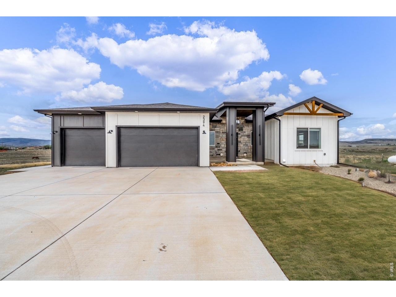 2394 Davis Street Fort Collins, CO 80524 - Photo 1 of 29 a front view of a house with a yard