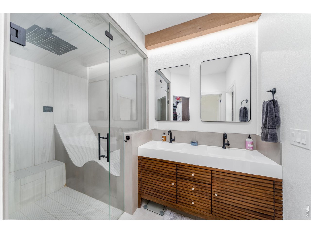 2394 Davis Street Fort Collins, CO 80524 - Photo 11 of 29 a bathroom with a double vanity sink and a mirror