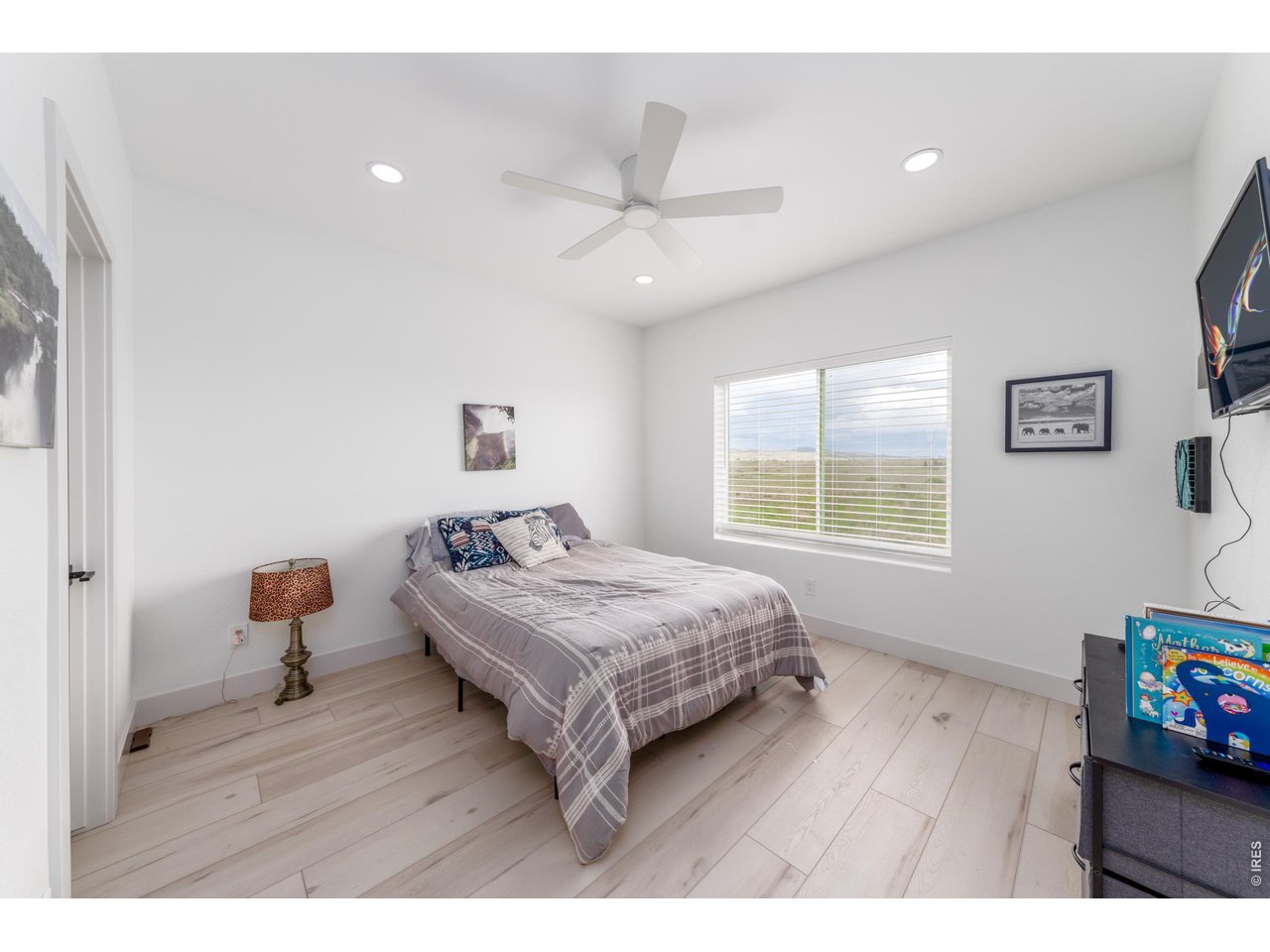 2394 Davis Street Fort Collins, CO 80524 - Photo 12 of 29 a bedroom with a bed and wooden floor