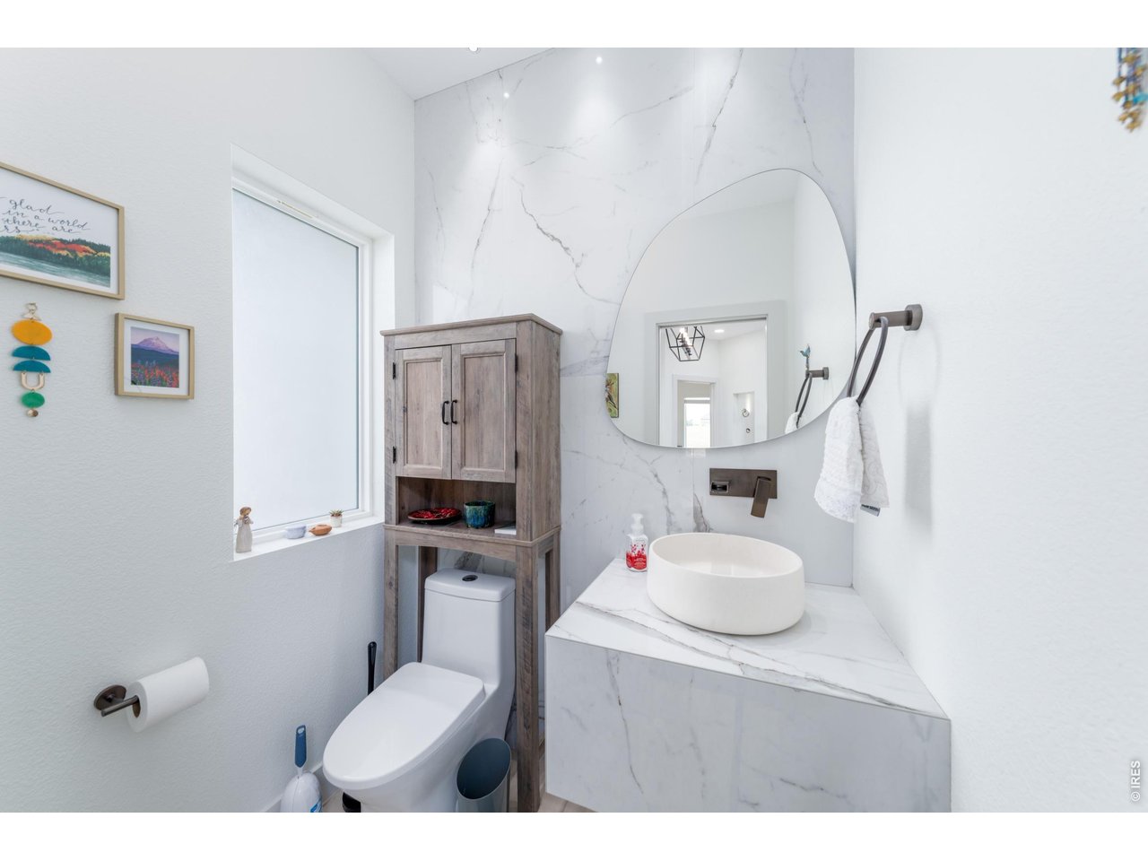 2394 Davis Street Fort Collins, CO 80524 - Photo 13 of 29 a bathroom with a sink vanity mirror and toilet