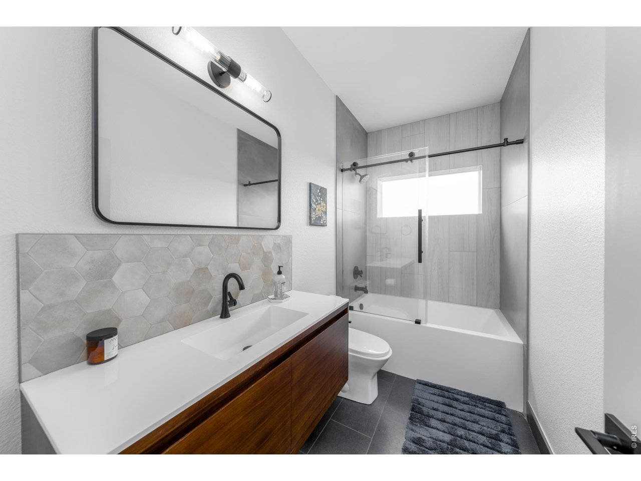2394 Davis Street Fort Collins, CO 80524 - Photo 15 of 29 a bathroom with a sink a toilet and shower