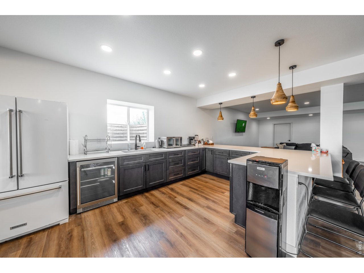 2394 Davis Street Fort Collins, CO 80524 - Photo 17 of 29 a kitchen with stainless steel appliances granite countertop a sink a stove and a refrigerator