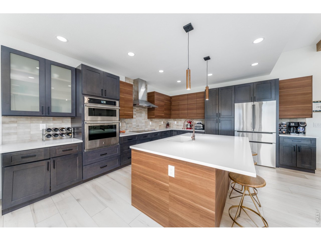 2394 Davis Street Fort Collins, CO 80524 - Photo 6 of 29 a large kitchen with stainless steel appliances kitchen island granite countertop a sink a stove and a refrigerator