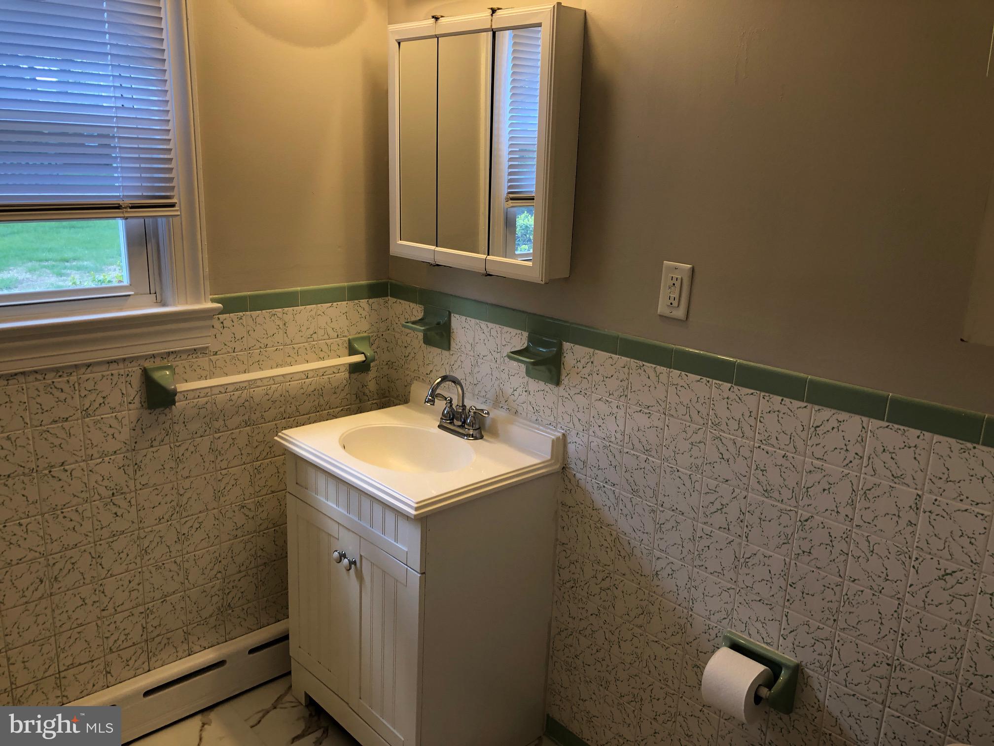 20618 Ridge Road Colonial Beach, VA 22443 - Photo 15 of 25 a bathroom with a sink and a mirror