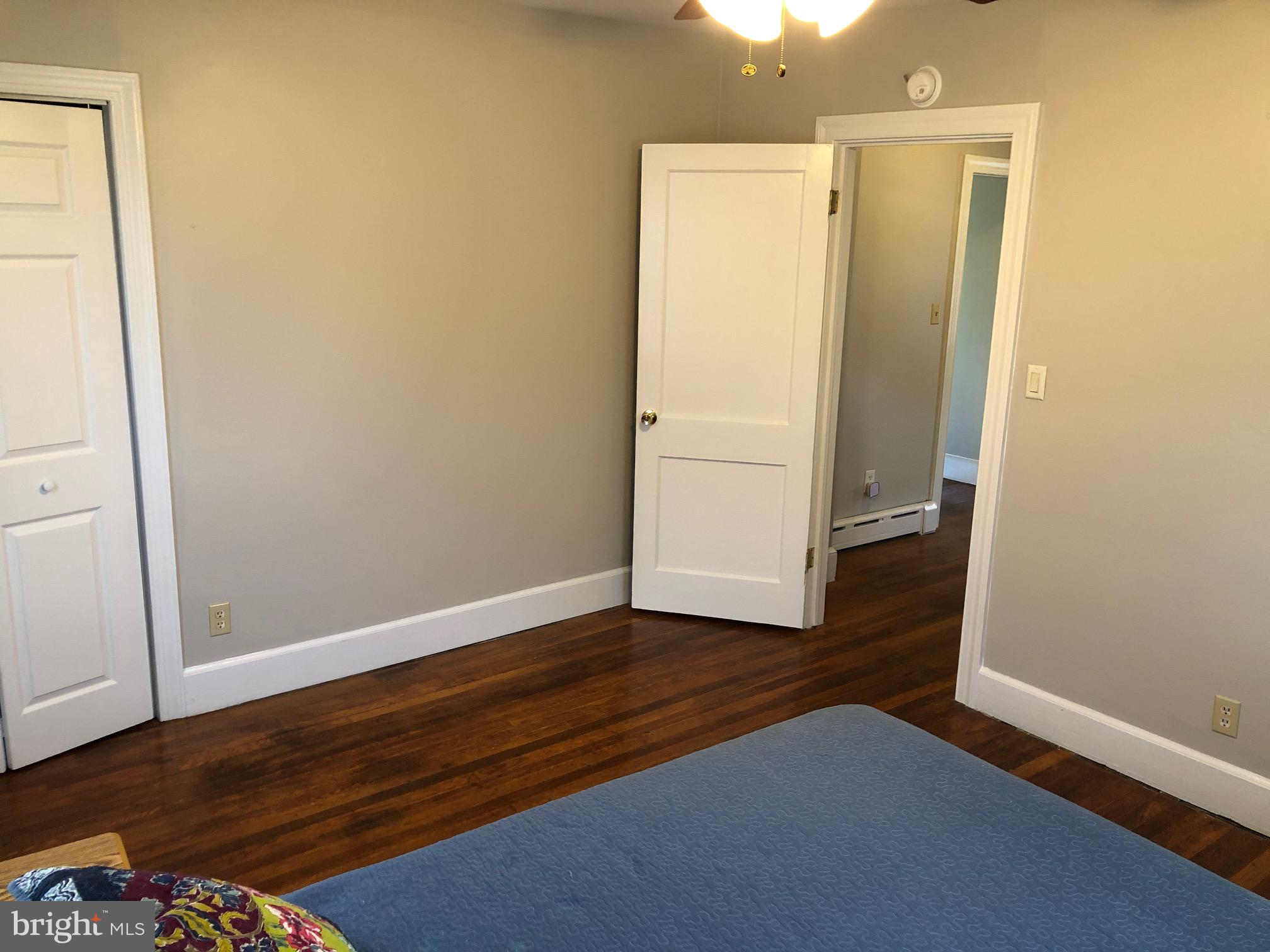 20618 Ridge Road Colonial Beach, VA 22443 - Photo 17 of 25 an empty room with wooden floor and closet
