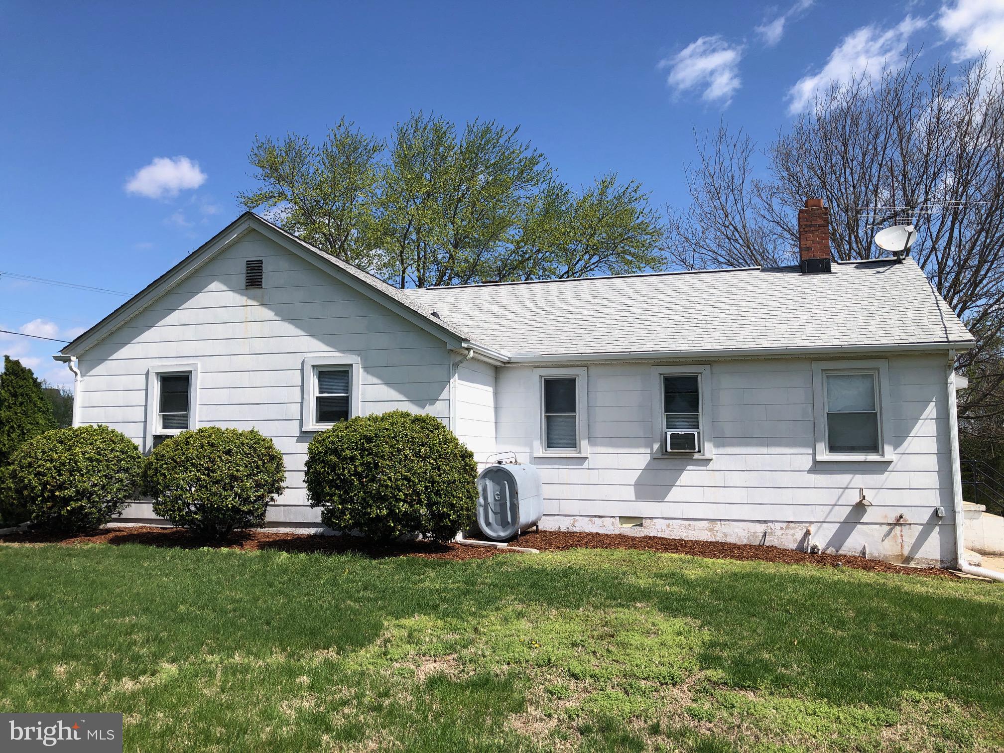20618 Ridge Road Colonial Beach, VA 22443 - Photo 3 of 25 a front view of house with yard and trees in the background